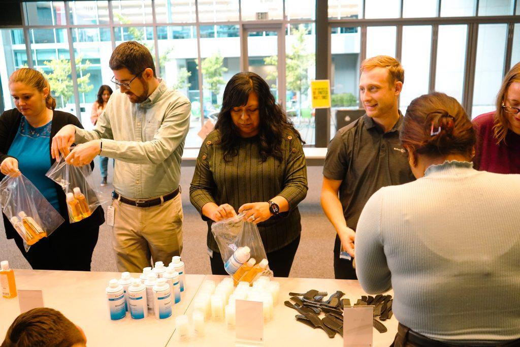 Burns & McDonnell employees pack hygiene kits internal workplace campaign