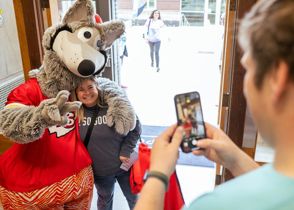 Community Fest KC Wolf greeting volunteer