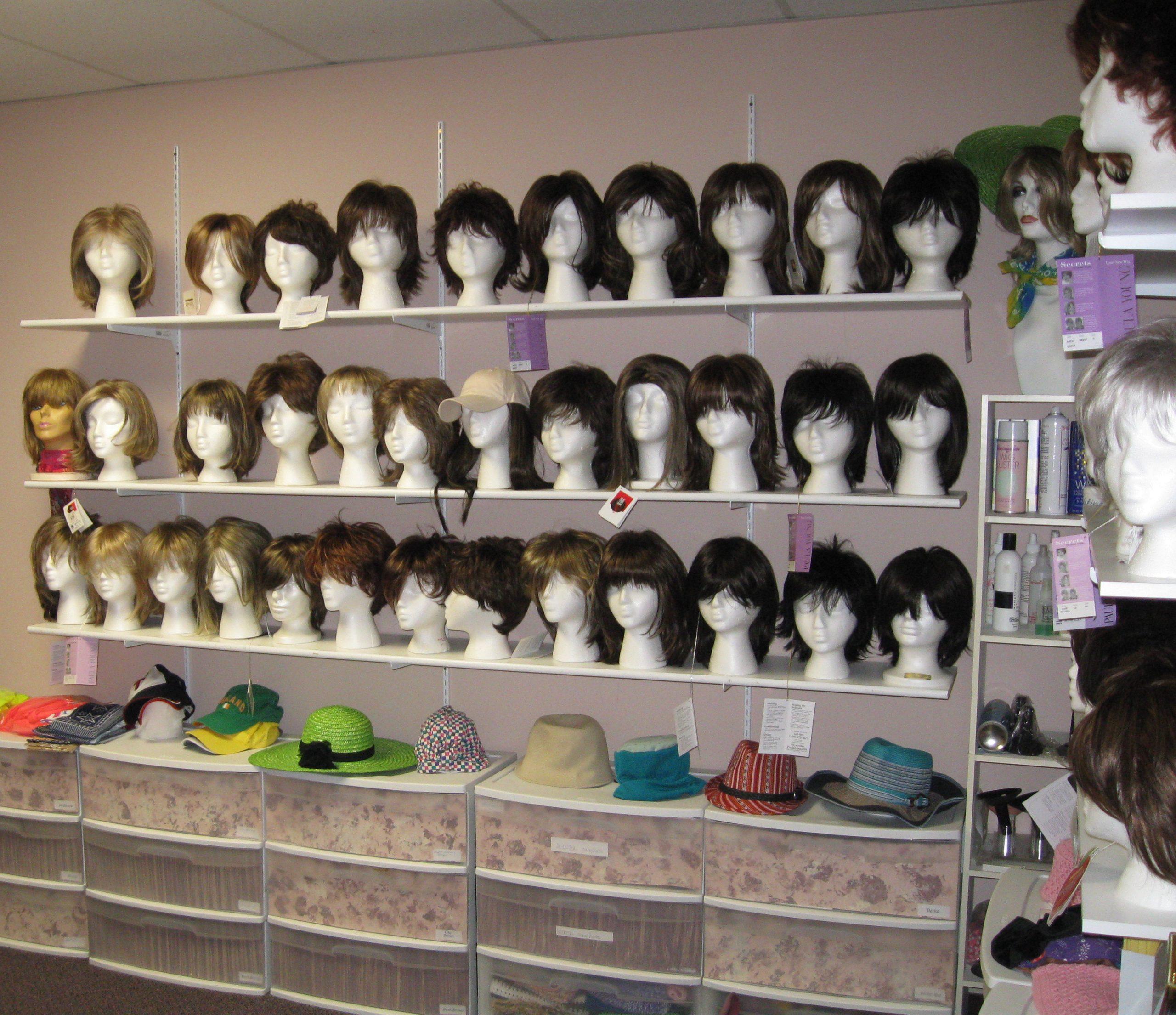 Images of wigs and hats at Cancer Action, Inc.